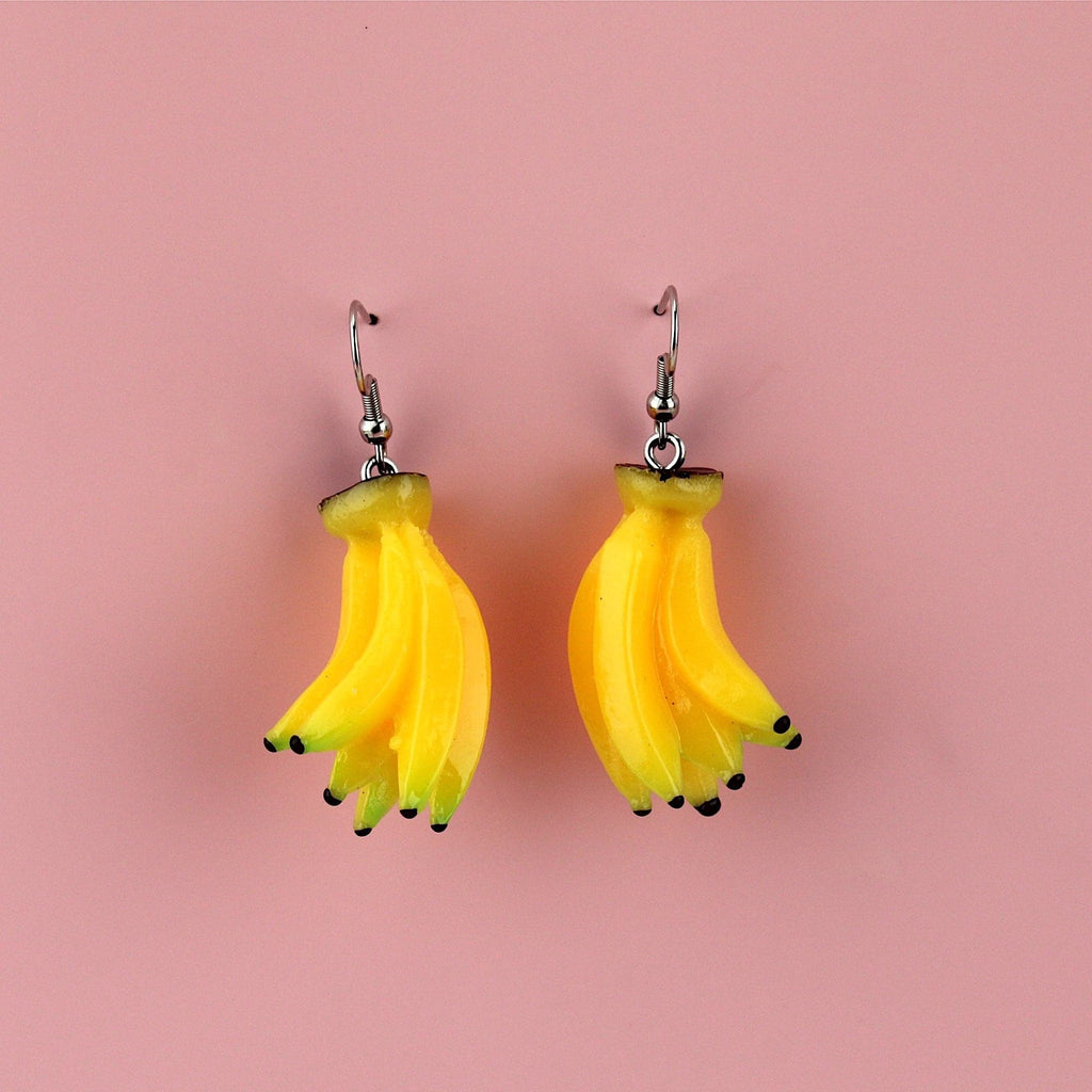 A bunch of resin banana charms on stainless steel earwires