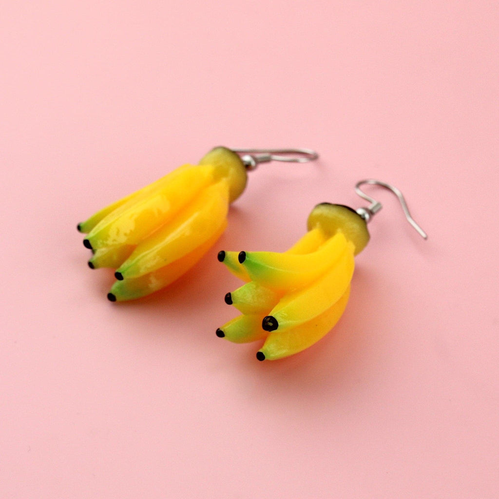 A bunch of resin banana charms on stainless steel earwires