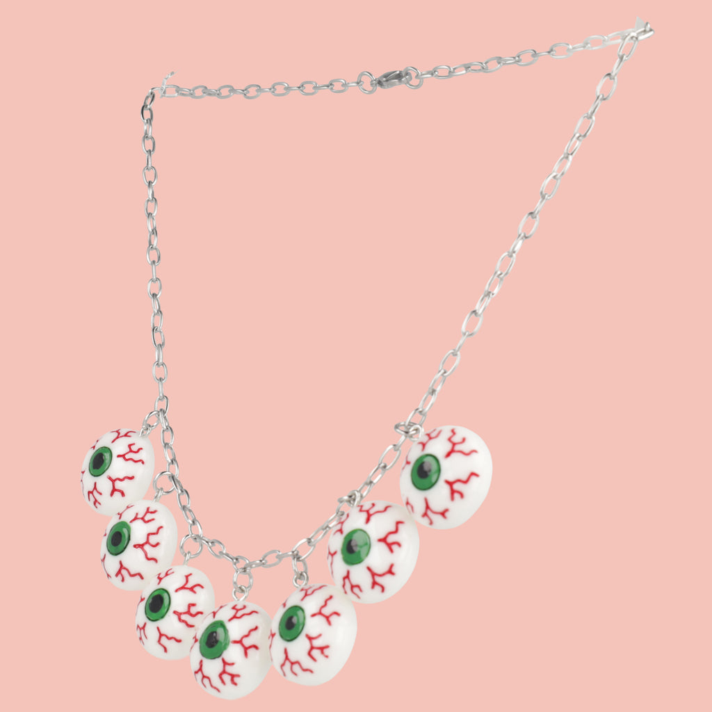 Seven Bloodshot eye pendants on an oval link stainless steel chain