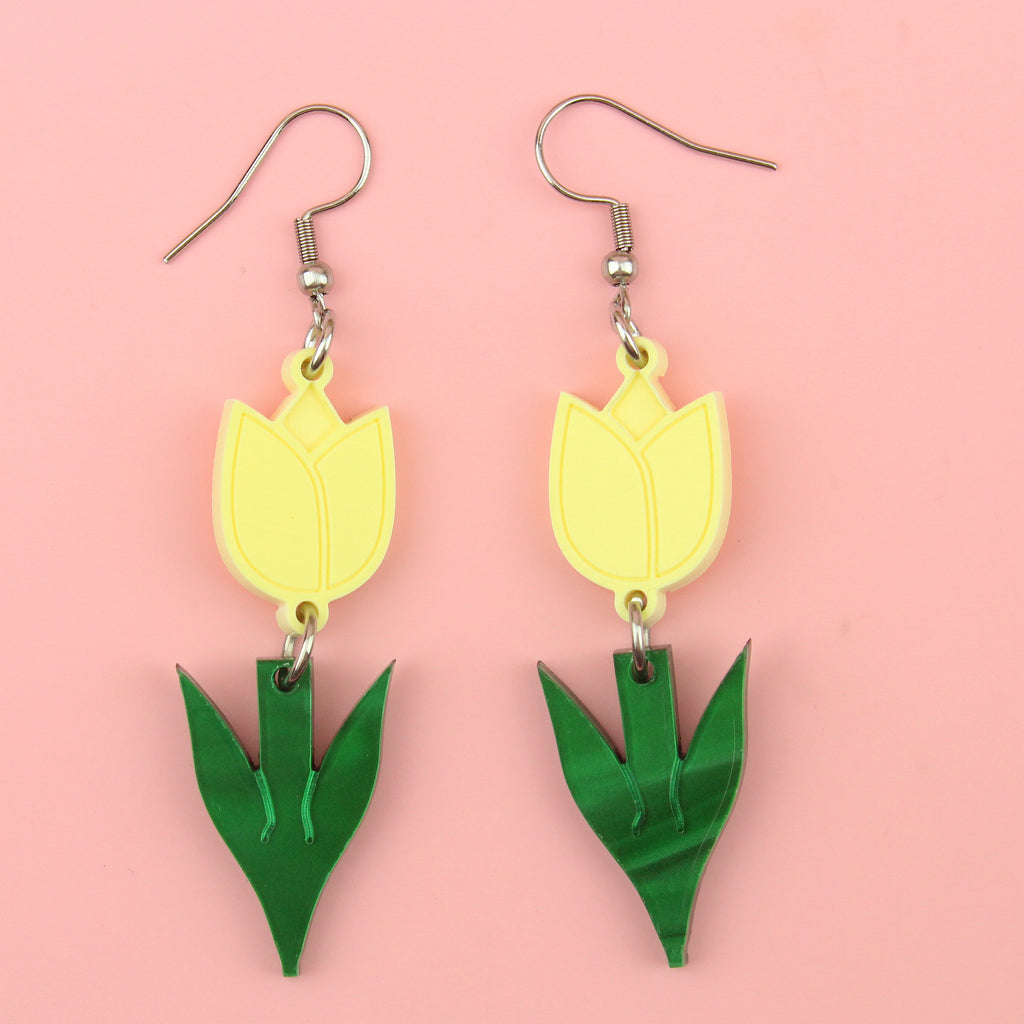 Yellow acrylic tulip charms with green stems on stainless steel earwires