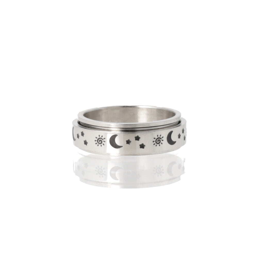 Titanium ring with a black sun, moon and stars design