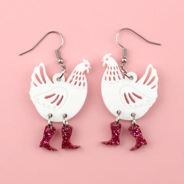 White perspex chicken charms with pink glittery cowboy boots on stainless steel earwires