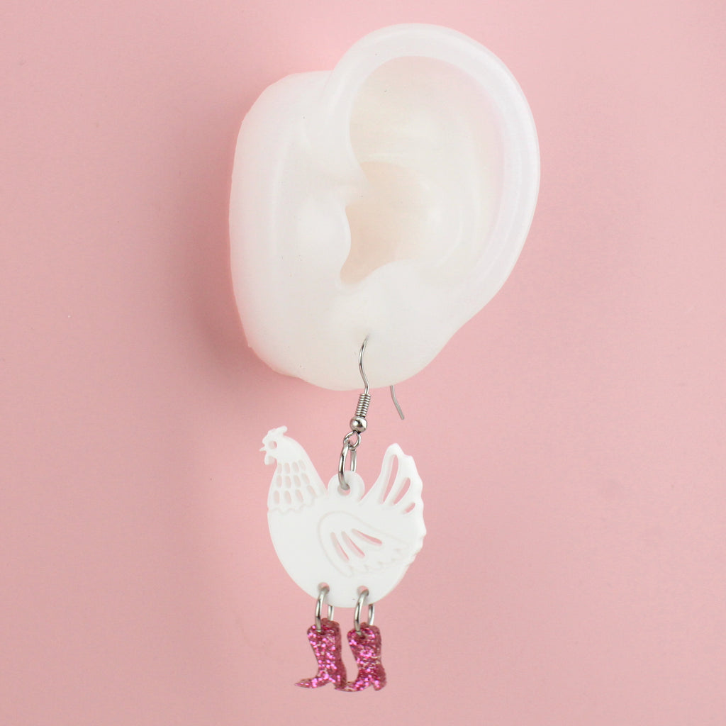Ear wearing White Chick Magnet Chicken Earrings