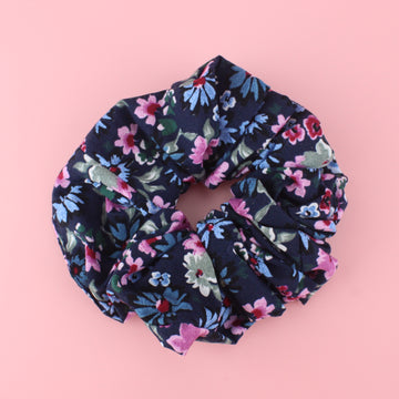 Navy scrunchie with a blue, pink and green floraal design