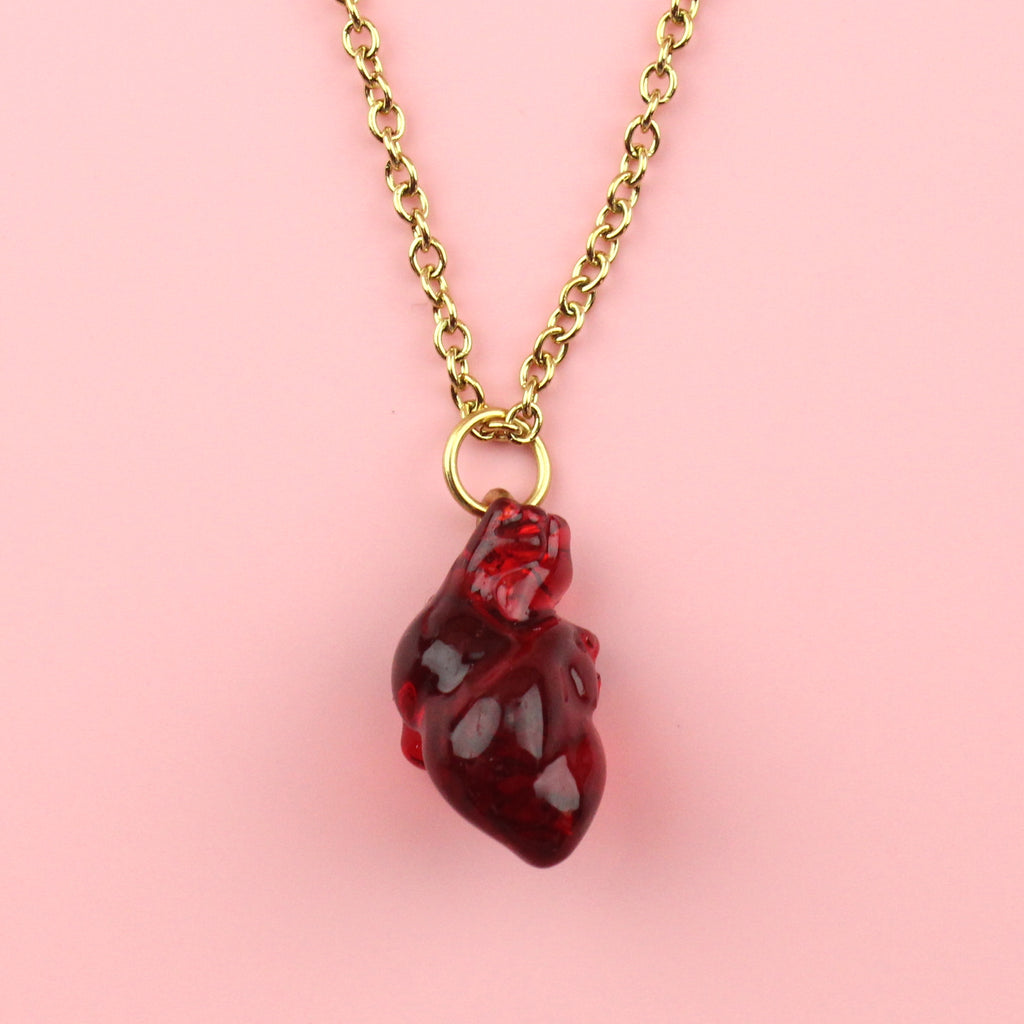 Resin heart pendant on a gold plated stainless steel chain