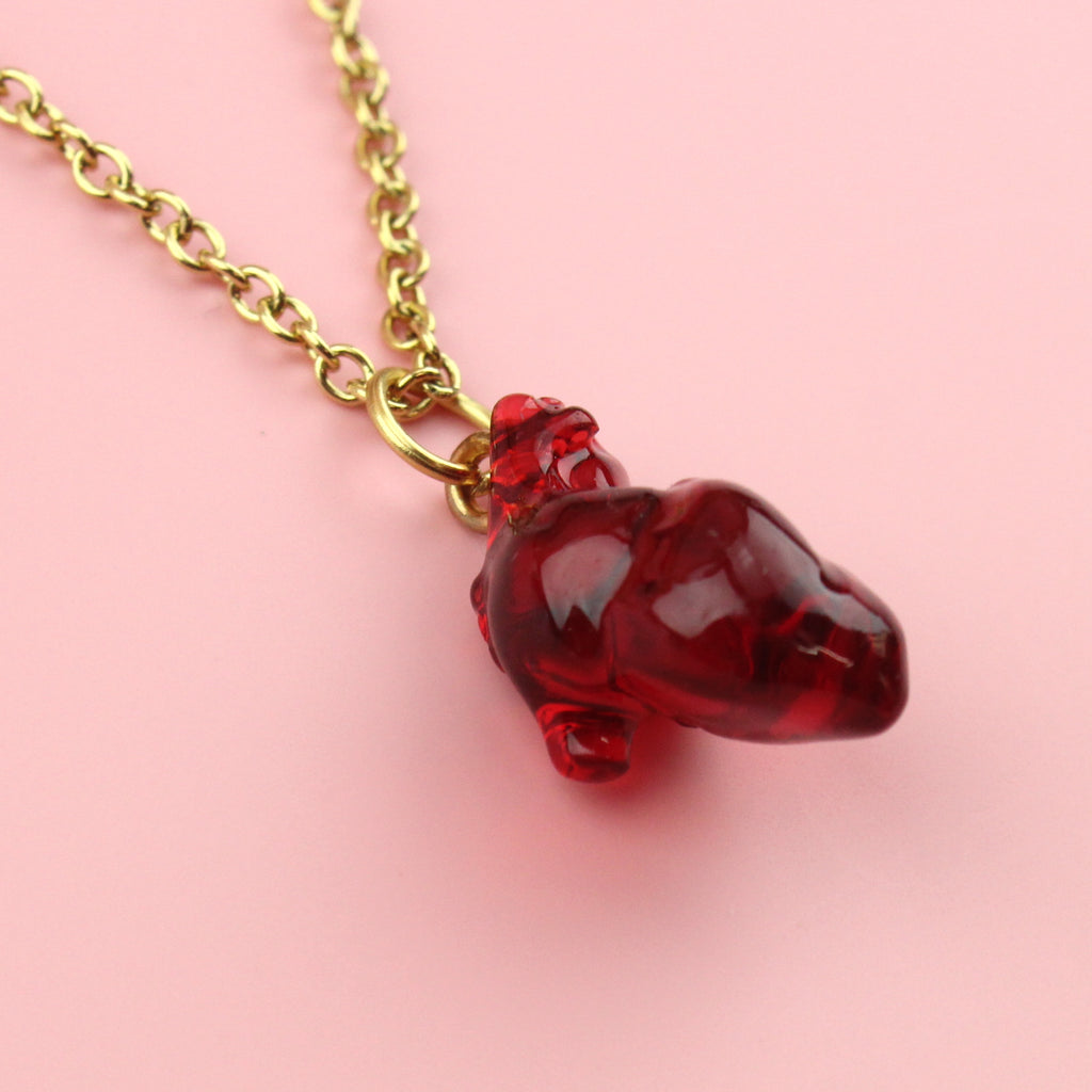 Resin heart pendant on a gold plated stainless steel chain