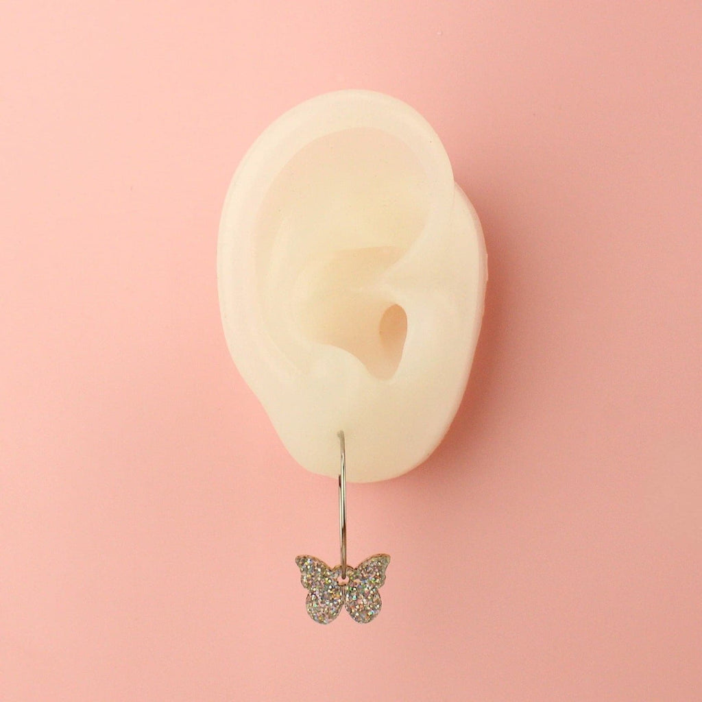 Ear wearing the You're My Butterfly, Sugar Baby Hoop Earrings (Holographic Glitter)