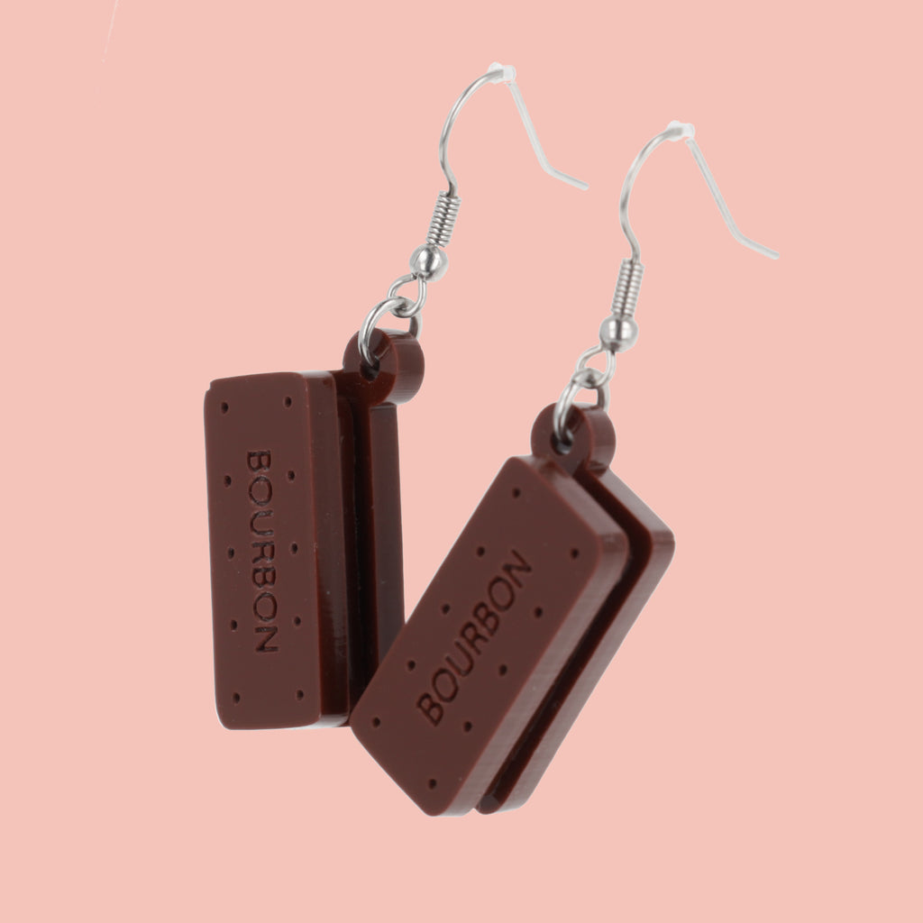 Bourbon biscuit earrings on a pink background