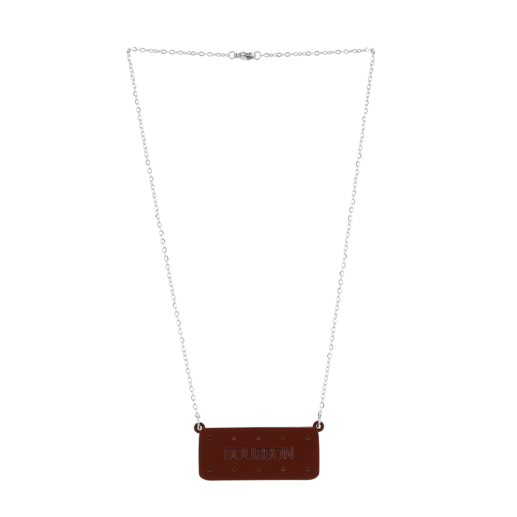 Necklace with a bourbon biscuit pendant on a white background