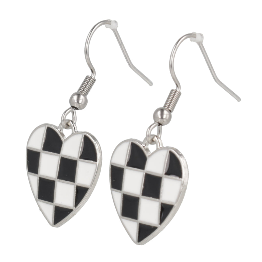 Heart-shaped checkered earrings with black and white pattern on a white background