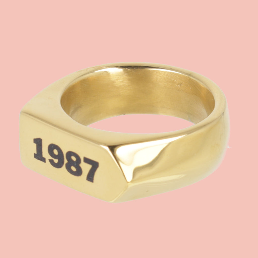 Chunky gold plated stainless steel ring with birth year engraved in black
