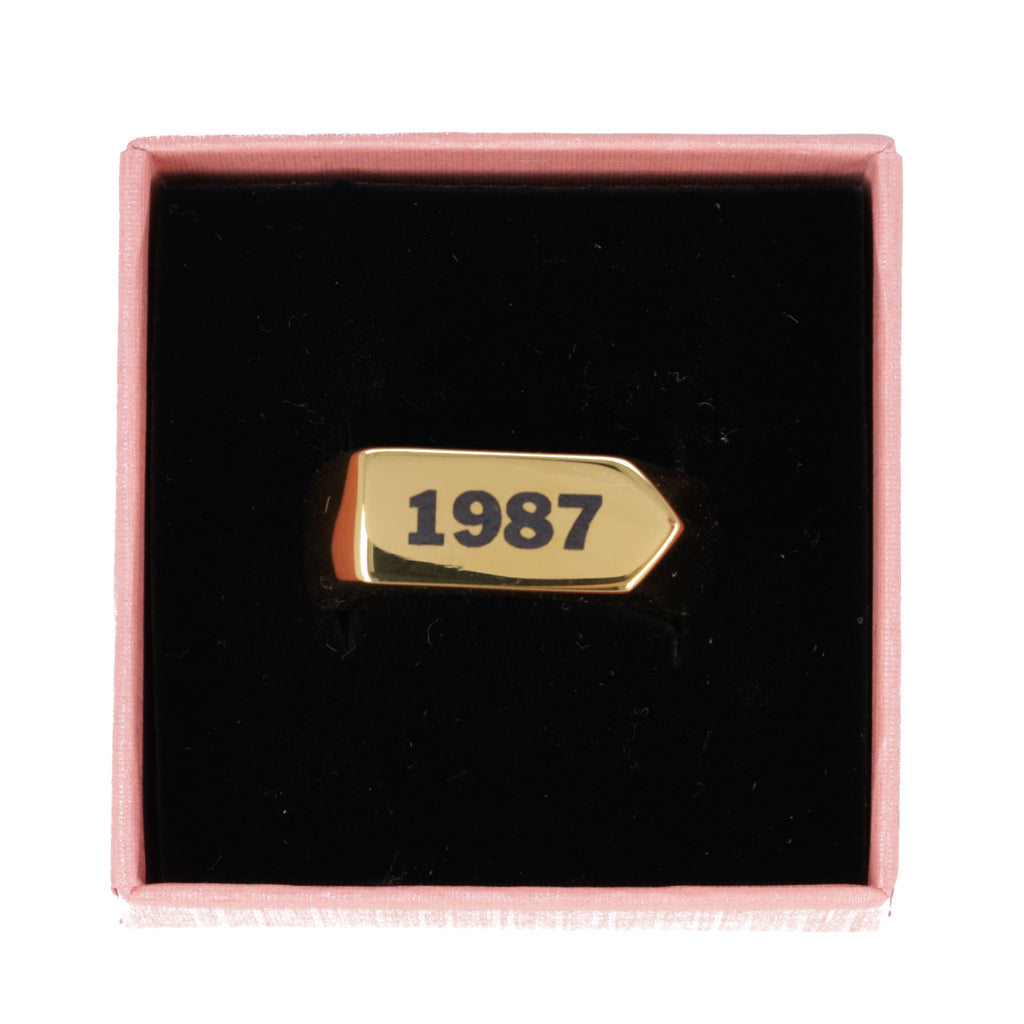 Chunky gold plated stainless steel ring with birth year engraved in black in a gift box