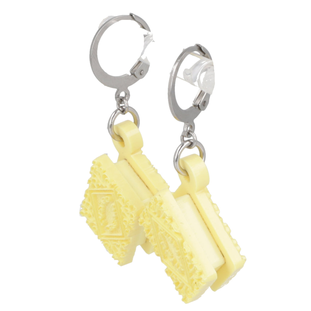 Yellow custard cream shaped earrings with silver hoops on a white background