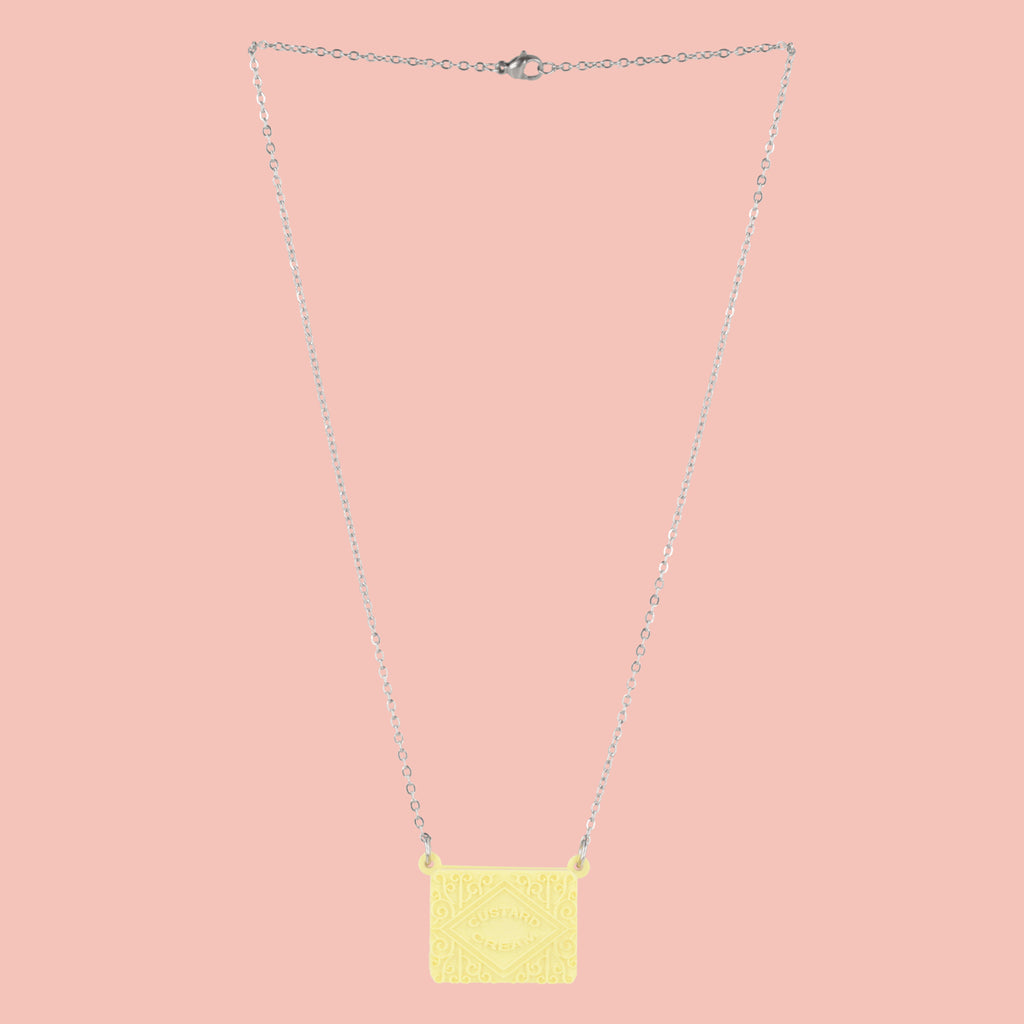 Custard cream necklace on a pink background