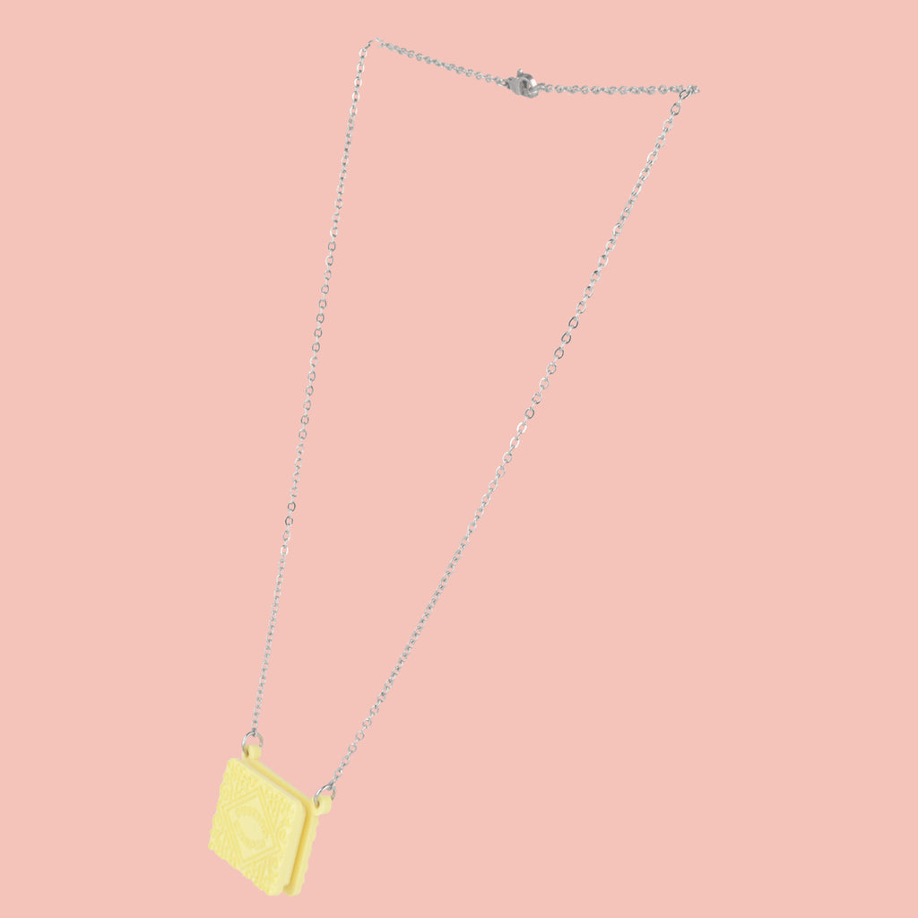Custard cream necklace on a pink background