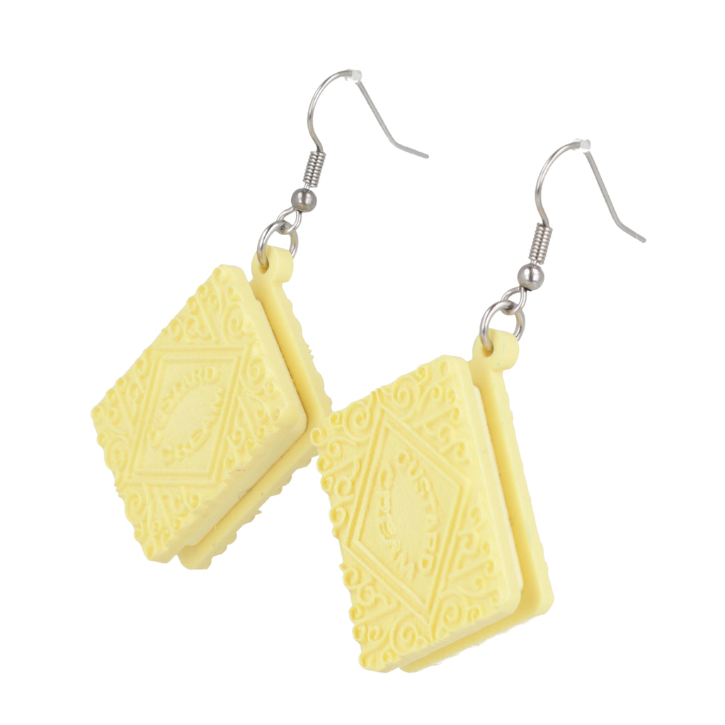 Custard cream earrings on a white background