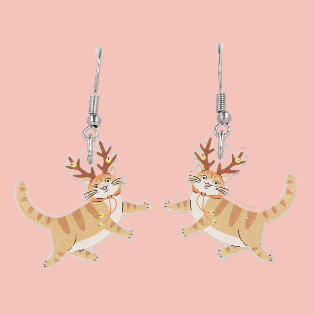 Cat with antlers earrings on a pink background