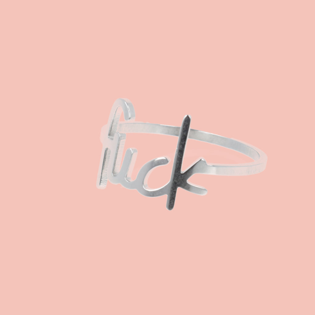titanium ring with the word f*ck imprited on the front