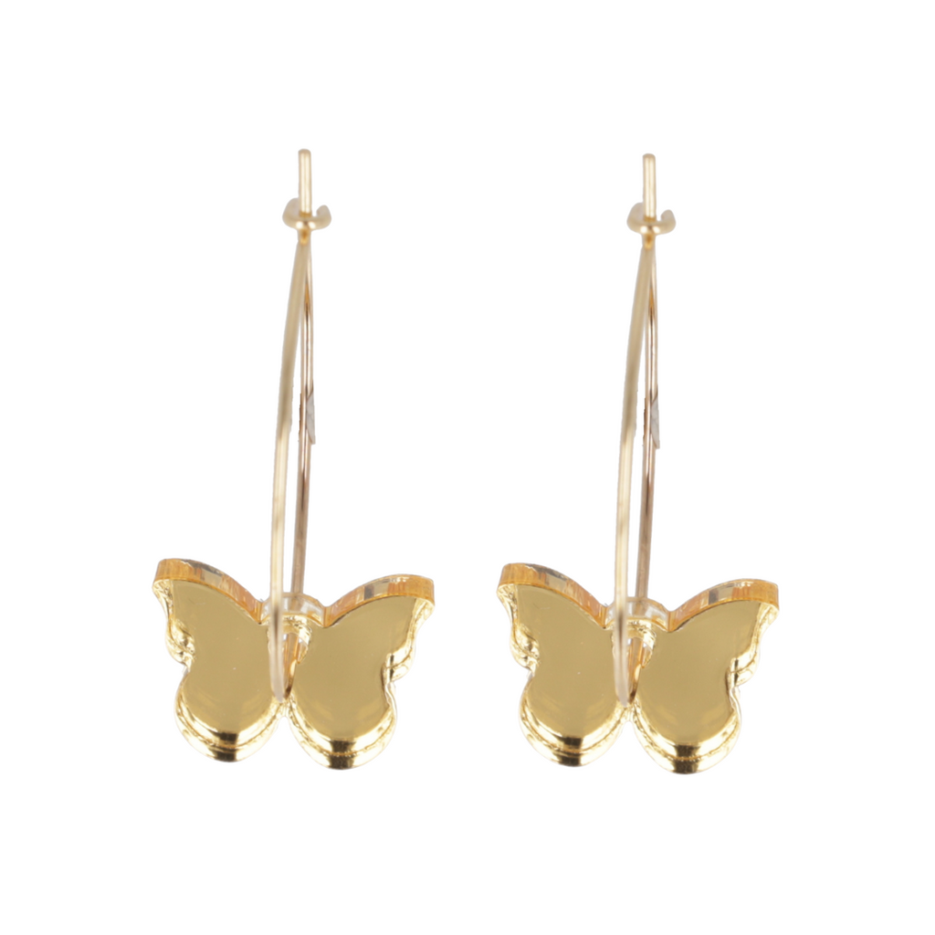 Gold butterfly earrings on a white background