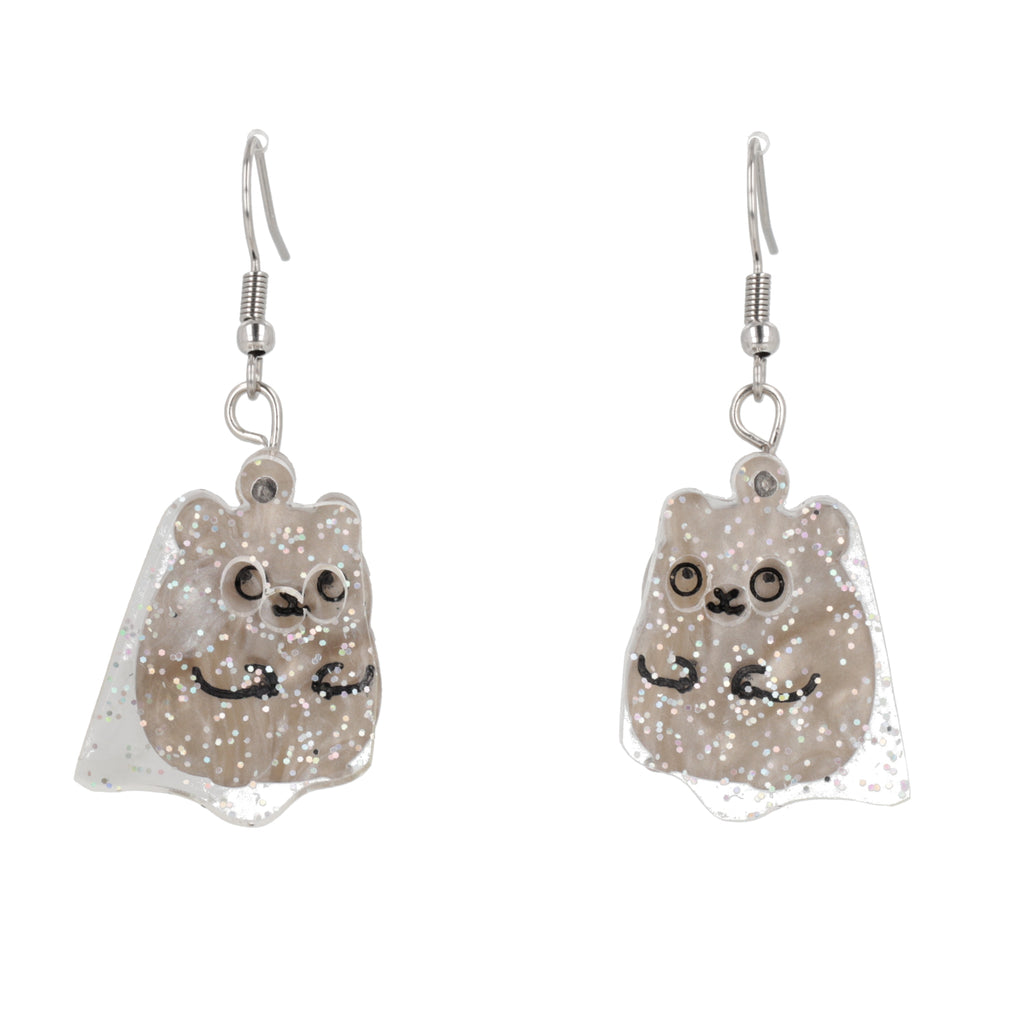 Ear wearing Grey hamster charms with an additional layer of holographic glitter to replicate a ghost on stainless steel earwires