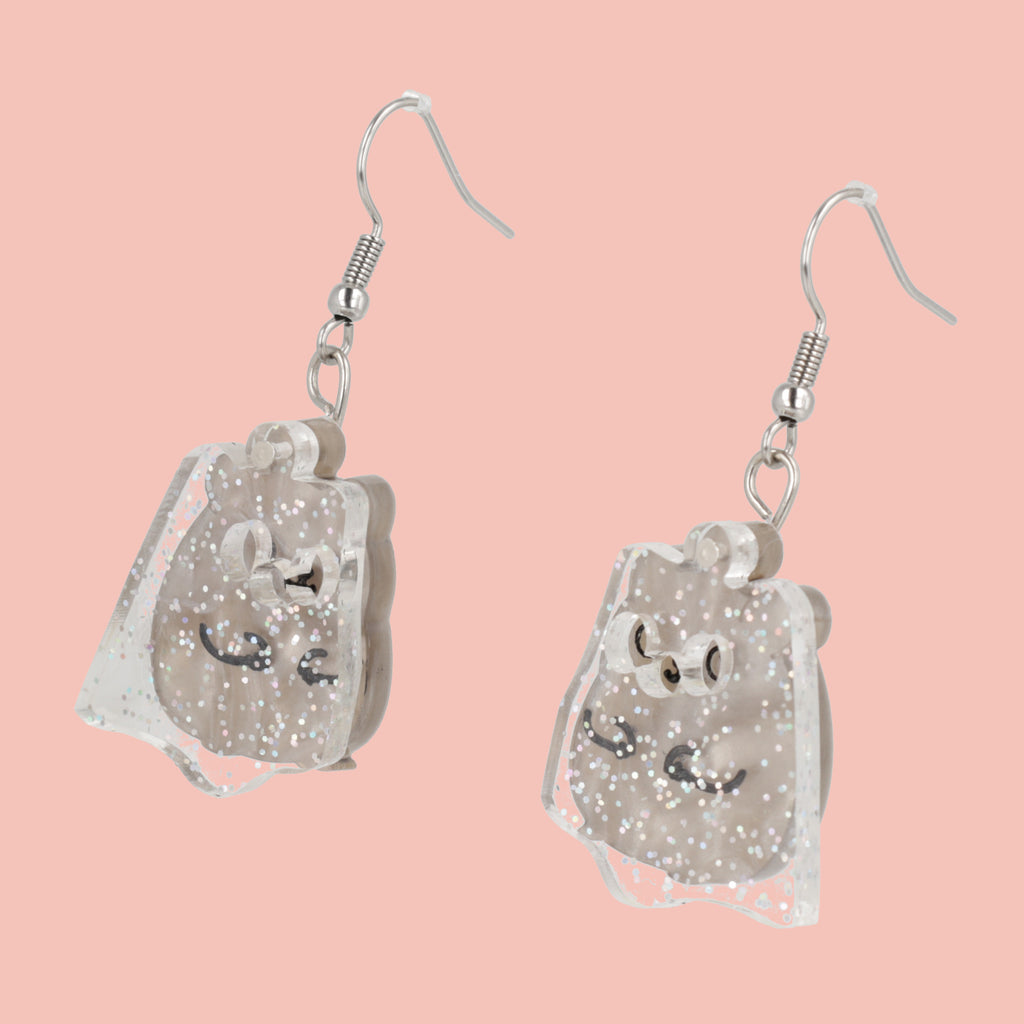 Grey hamster charms with an additional layer of holographic glitter to replicate a ghost on stainless steel earwires