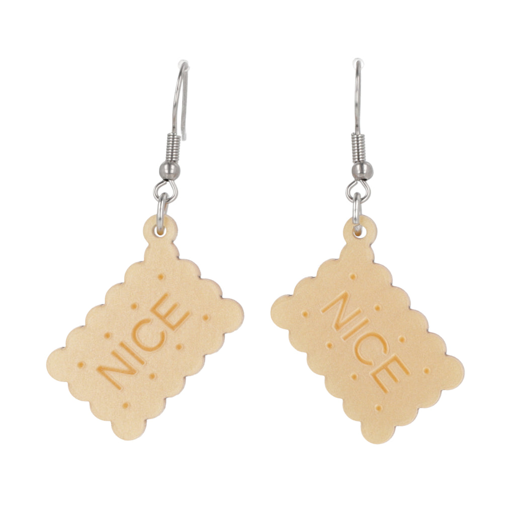 Earrings with nice biscuit charms on a white background