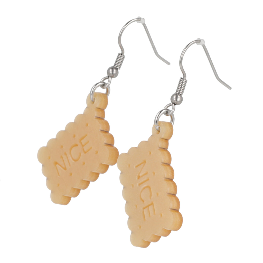 Earrings with nice biscuit charms on a white background