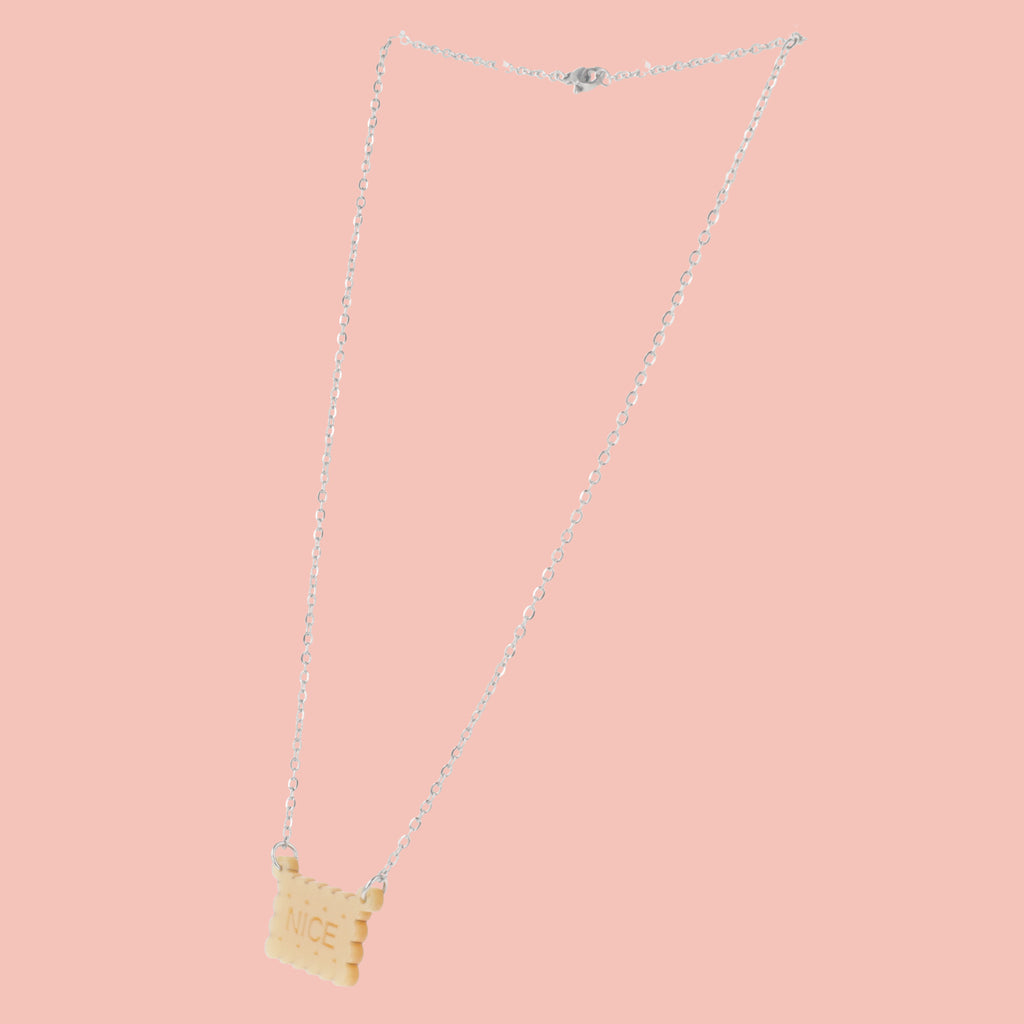 Necklace with a nice biscuit pendant on a pink background