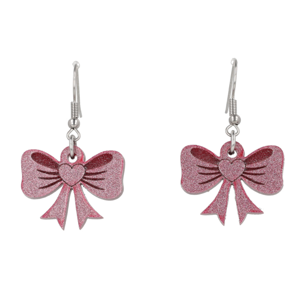Pink glittery bow earrings on a white background
