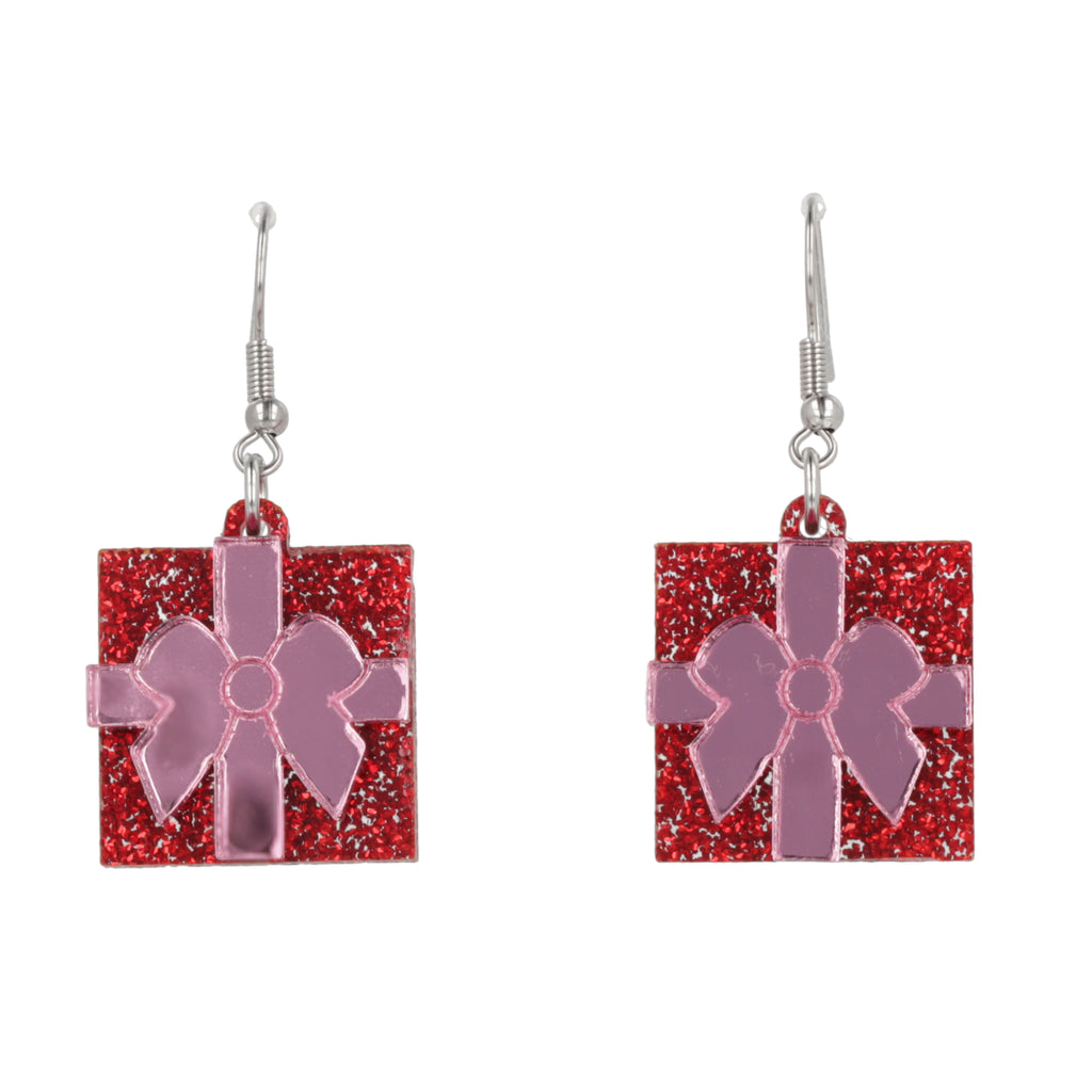 Red glittery gift box earrings with pink bows on a white background