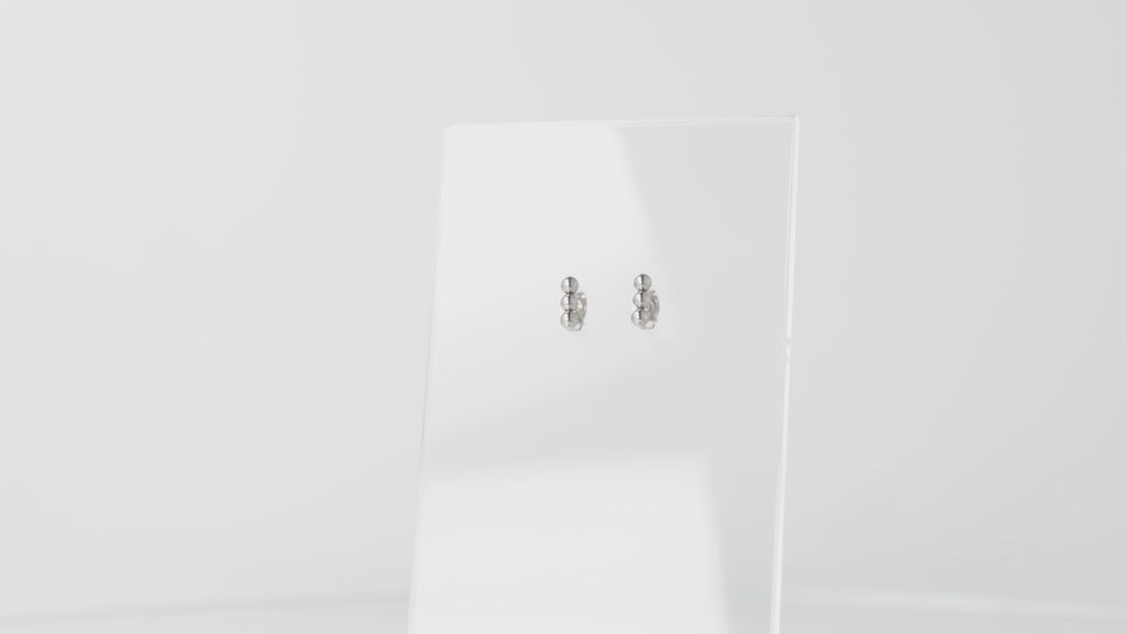 360 VIEW OF stainless steel studs featuring 3 STAINLESS STEEL beads in a vertical line
