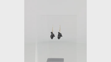 Black human heart charms on gold plated stainless steel earwires