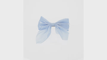 Shimmery blue bow with a base metal clip atta
