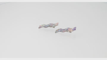 Wavy alligator clips featuring a purple abalone design