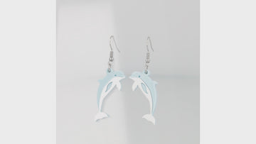 360 view of Light blue acrylic Dolphin charms on stainless steel earwires