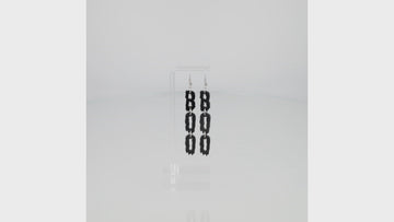THE LETTERS B, O, O SPELLED OUT VERTICALLY WITH A BLACK DRIPPY EFFECT ON STAINLESS STEEL EARWIRES
