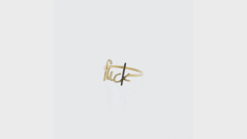 Gold plated titanium ring with the word f*ck printed on the front