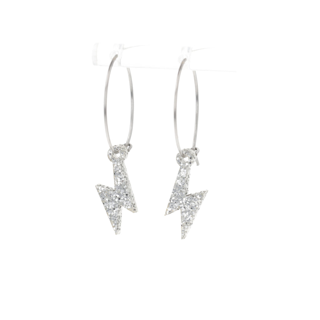 Mini Silver Glitter Lightning Bolt charms on stainless steel hoops