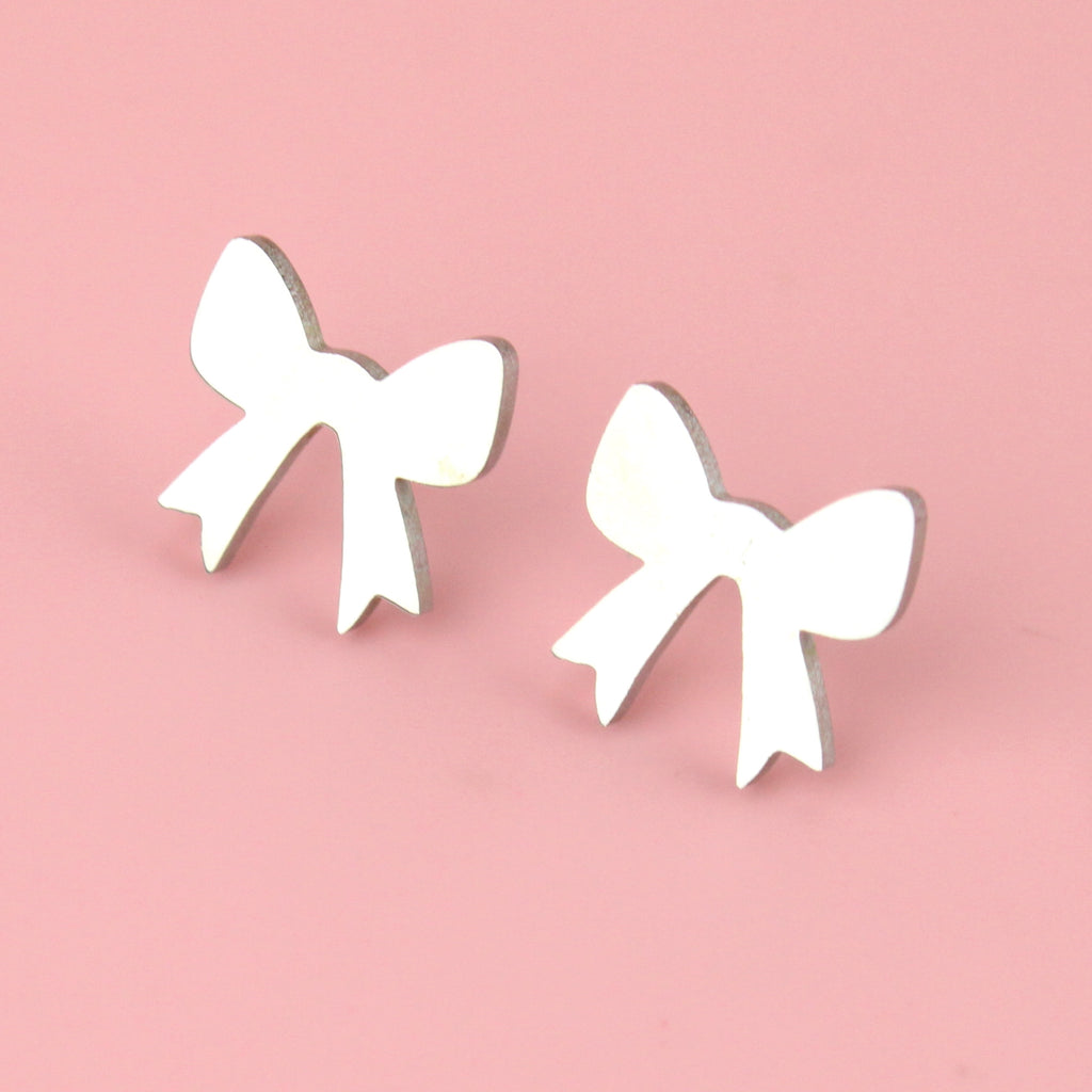 Stainless steel bow shaped studs