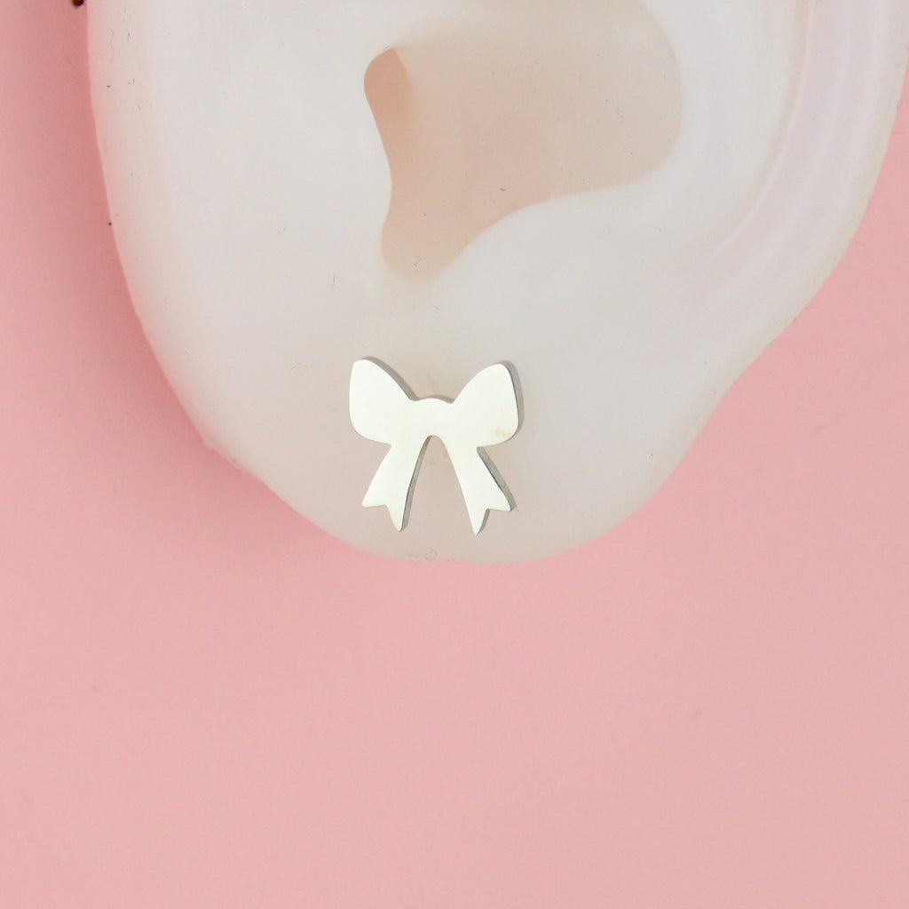 Ear wearing stainless steel bow shaped studs