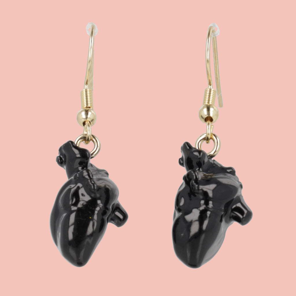 Black human heart charms on gold plated stainless steel earwires