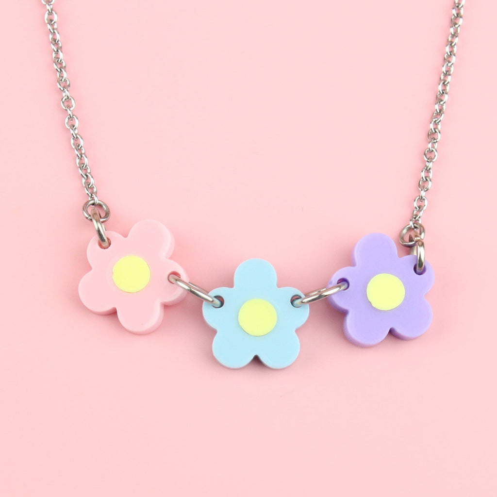 Necklace with Three Flowers in Pink, Blue, Purple all with a yellow centre