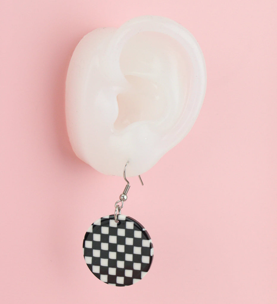 Ear wearing Black & White Checkerboard Earrings