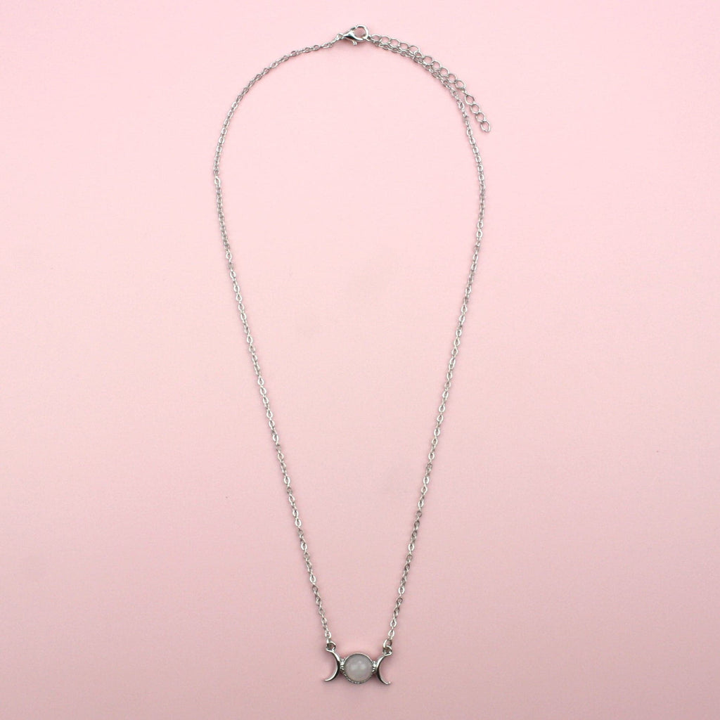 Base Metal Necklace featuring a rose quartz pendant with 2 moons either side of it