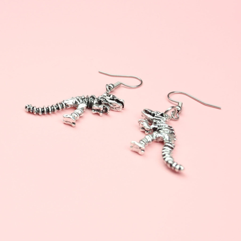 T-Rex Dinosaur Skeleton Earrings - Sour Cherry