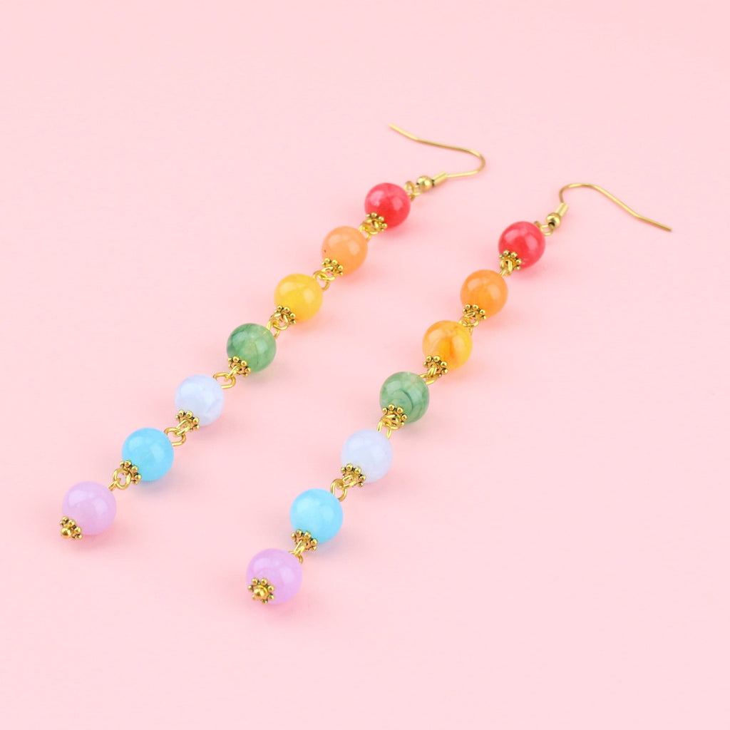 Rainbow coloured beads on gold plated charms with gold plated stainless steel earwires