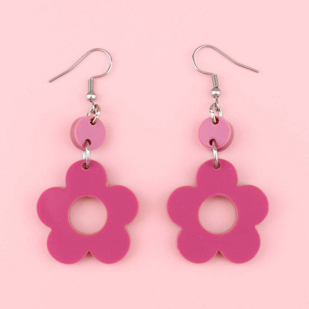 Hot pink flower charms with cut out middle on stainless steel earwires