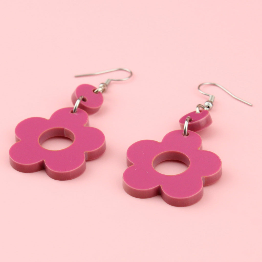 Hot pink flower charms with cut out middle on stainless steel earwires