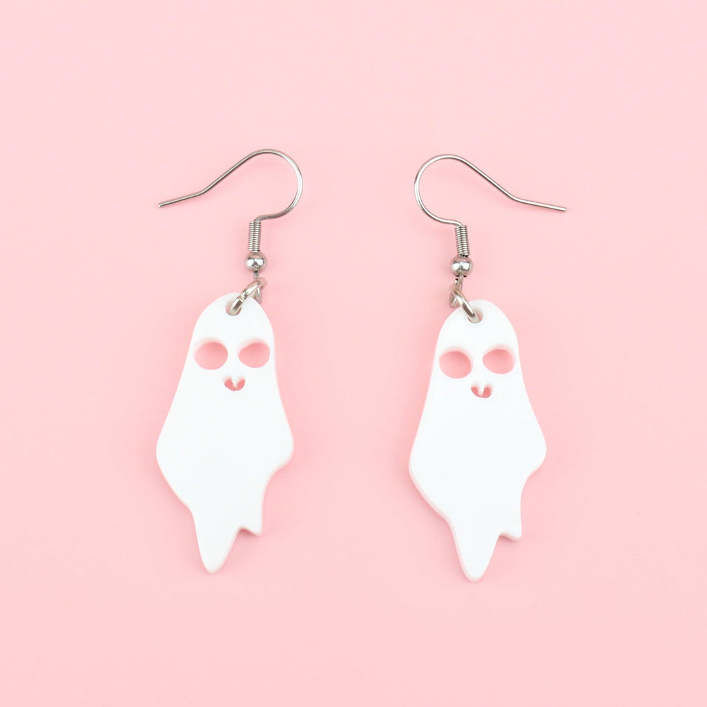 White acrylic ghost charms with cut out eyes and mouth on stainless steel earwires