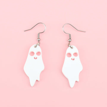 White acrylic ghost charms with cut out eyes and mouth on stainless steel earwires